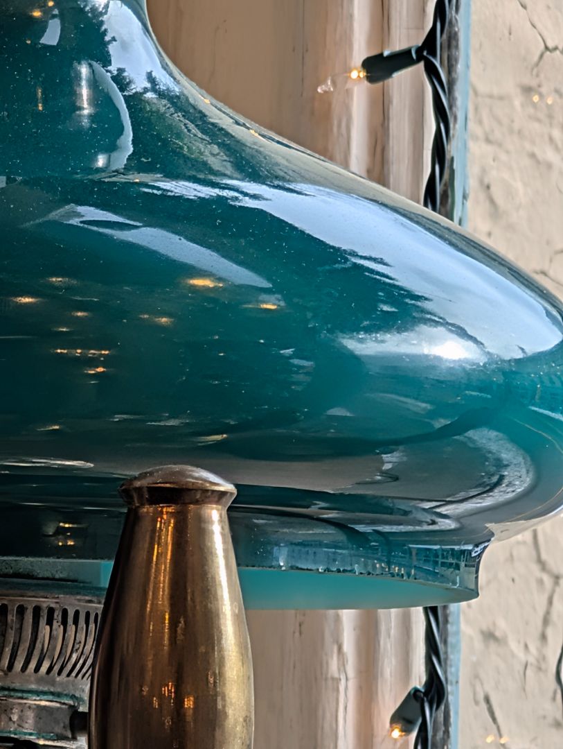 Fantastic early kerosene lamp with a wonderful green shade on it converted to electric with a turn knob on base