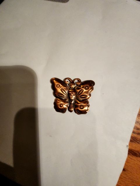 Copper tribal butterfly brooch