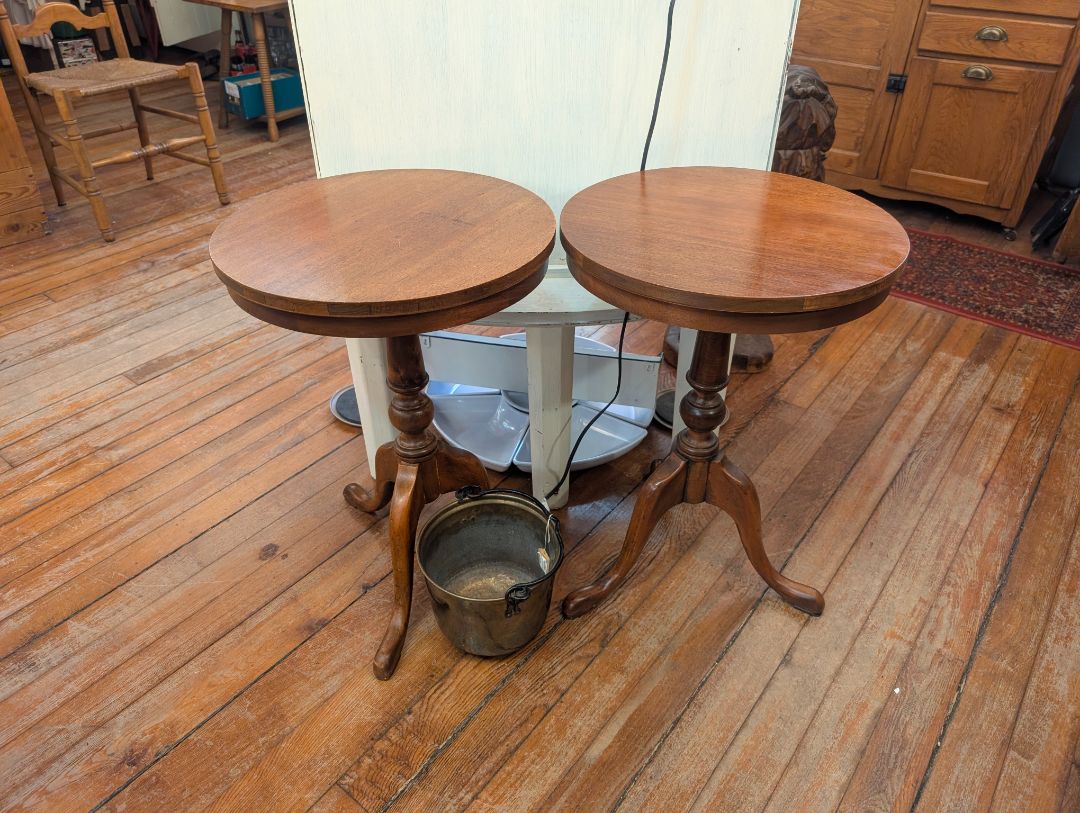 Matched pair of mahogany, three-leg and tables?