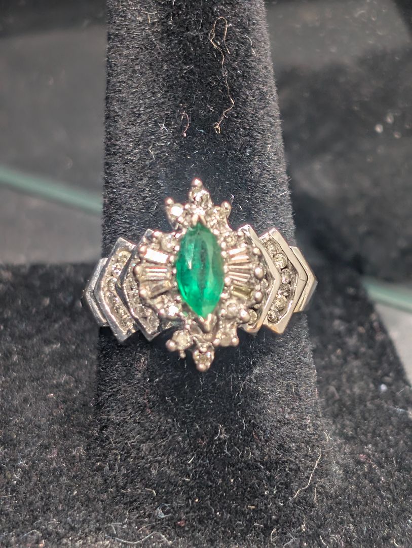 14 karat white gold ring with emerald in diamonds