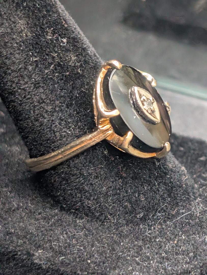 10 karat gold ring with onyx and diamond.
