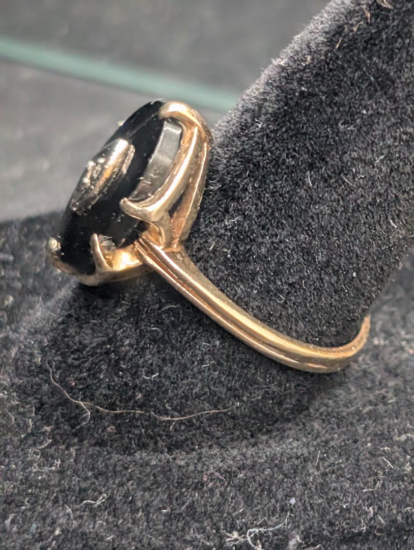10 karat gold ring with onyx and diamond.