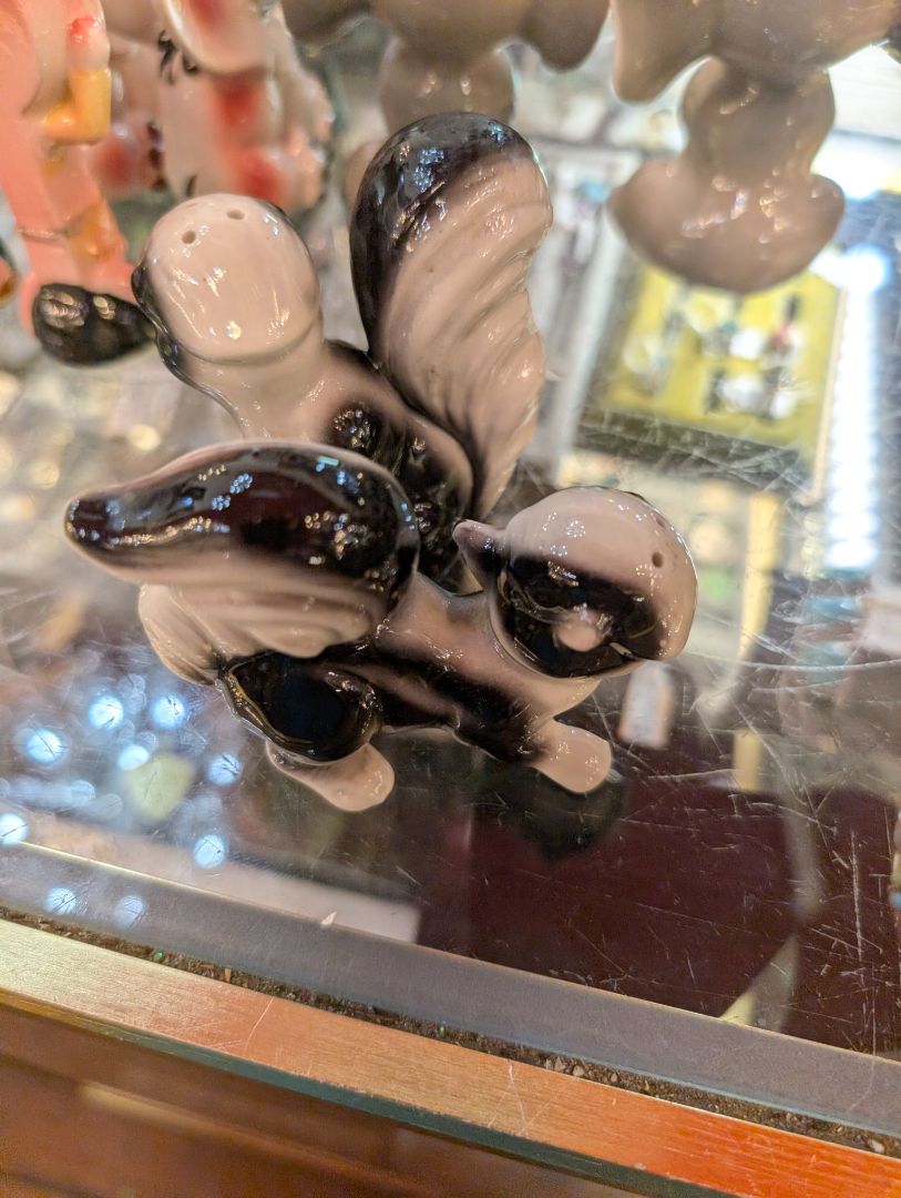 Porcelain skunk salt and pepper shaker