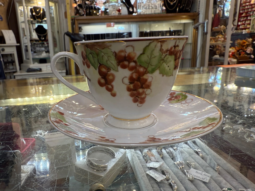 Hand painted signed China teacup and saucer