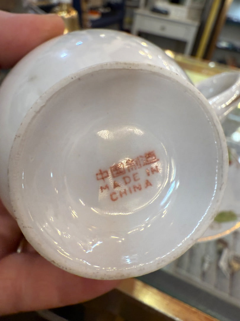 Hand painted signed China teacup and saucer