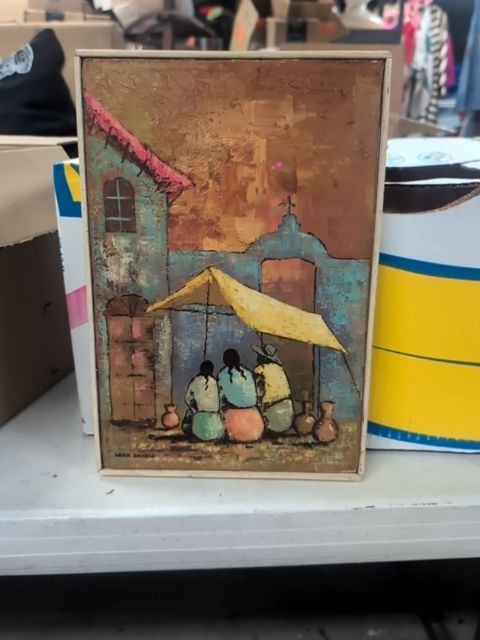Paint of Girls sitting under tent by a building