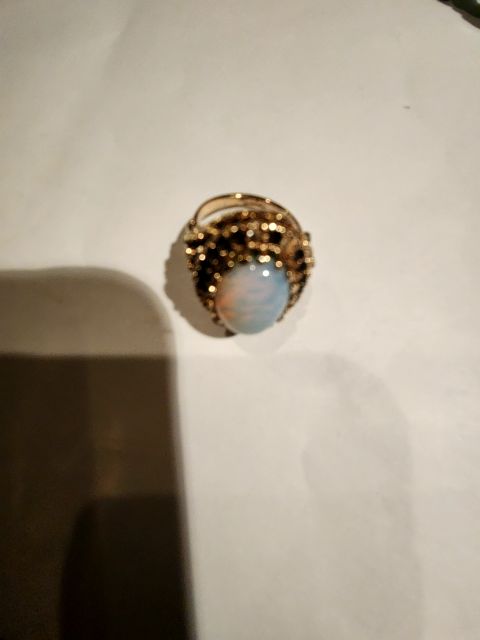 Gold over opal ring
